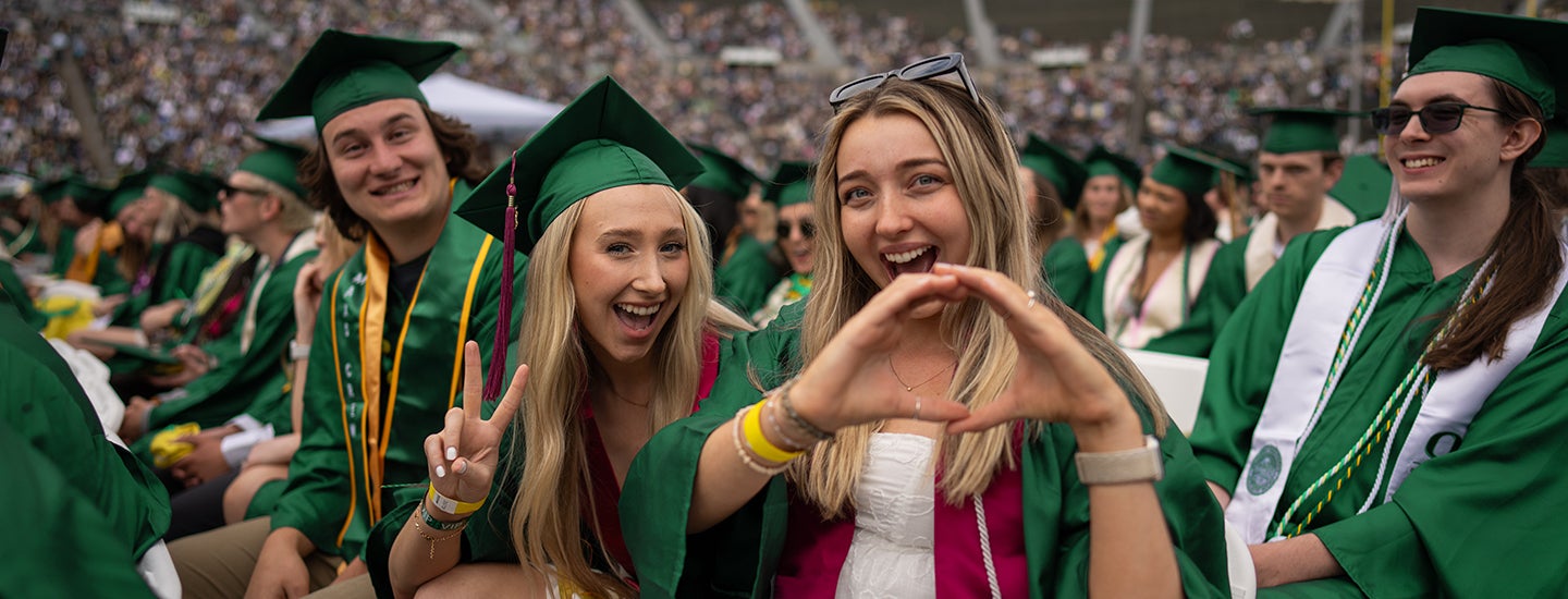 Students throw the O and give a peace sign