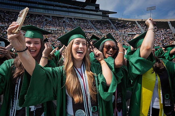 Graduates celebrate at Autzen Stadium